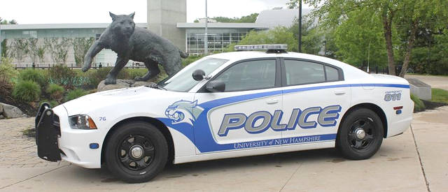 UNH Police Cruiser parked in front of the Whittemore Center Arena